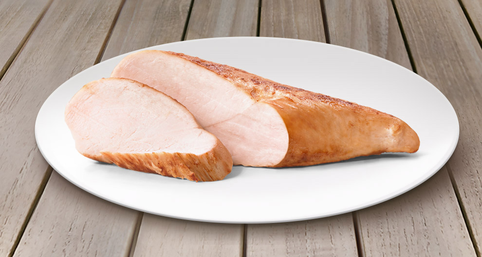 A slice of cooked meat is presented on a white plate.